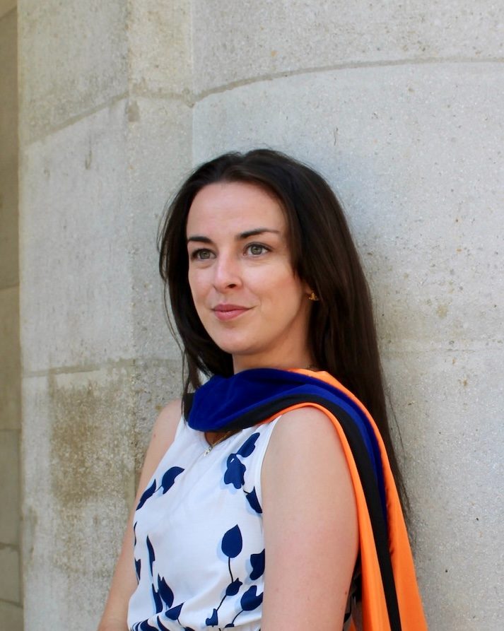 Rayven Crisafulli, PhD, CMP, founder of Resonance Co., in doctoral regalia at the University of Florida