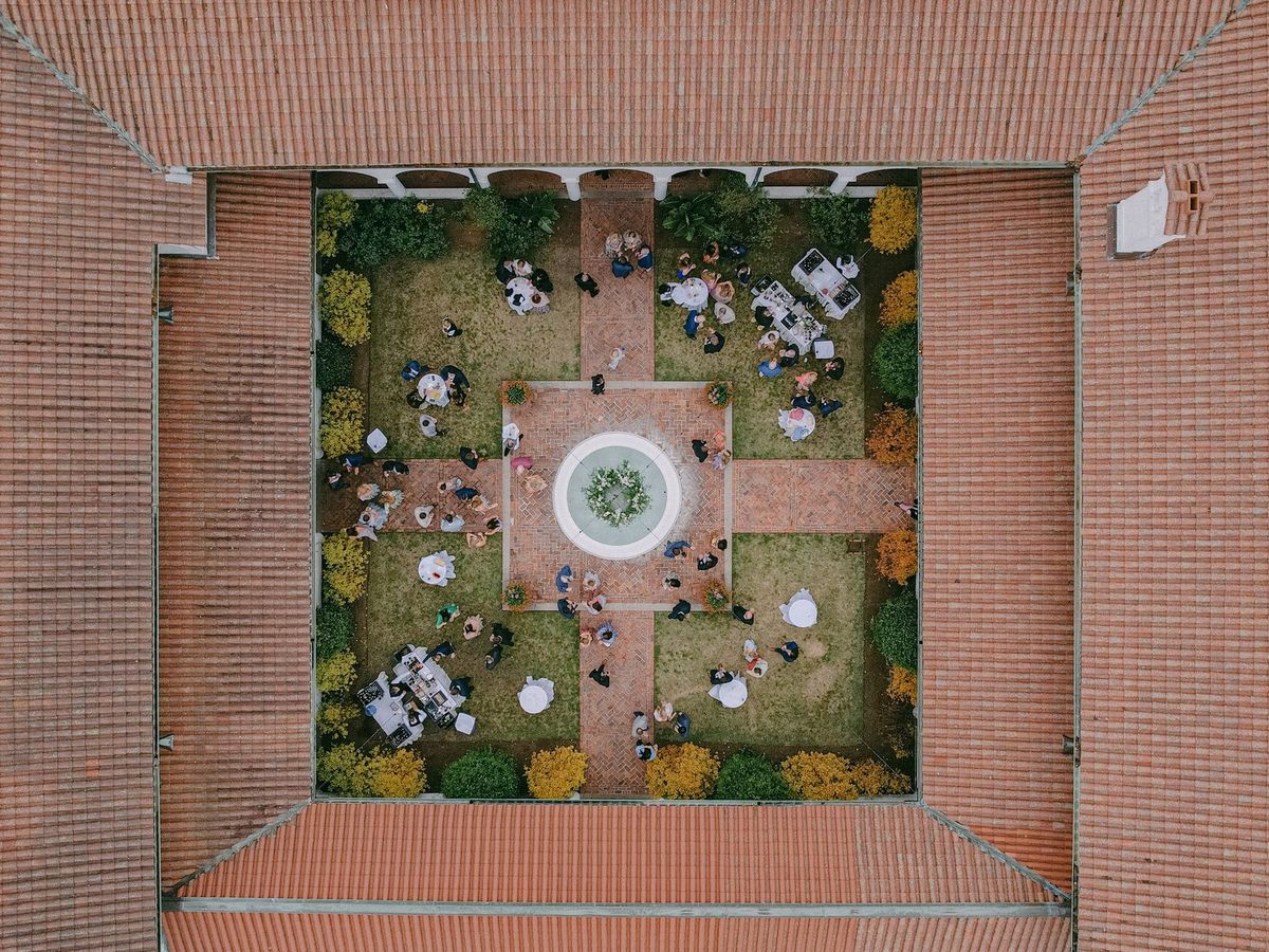 Aerial view of Crane Cottage courtyard during cocktail hour at Jekyll Island Club Resort